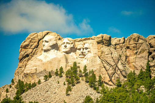 View of the four presidents at Mount Rushmore with full face of George Washington and side views of the others.