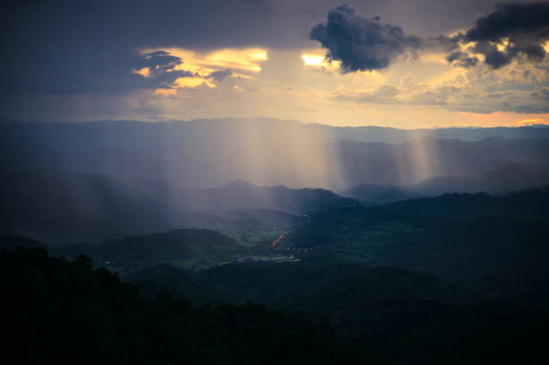 landscape of Mountains under raining clouds at dusk