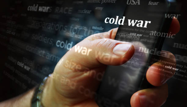 istock Cold war news titles on screen in hand 3d illustration 2150002636