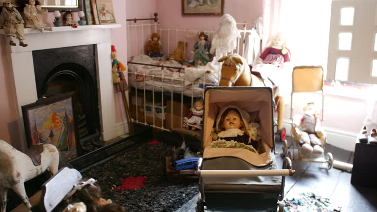 Victorian nursery room with antique dolls, vintage toys, and classic creepy baby carriage, ideal for historical settings. Cozy, old-time child's room with fireplace