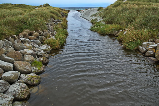 Creek at the beach Refsnesstranda at the scenic route Jaeren in Norway, Europe