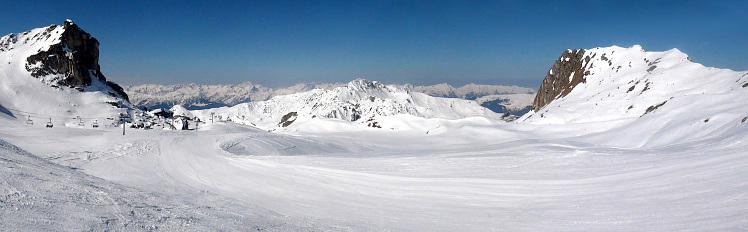 Panoramic view of the ski slopes of the famous La Plagne-Bellecote ski resort in the heart of the French Alps in the Tarentaise valley at the foot of Mont Blanc.