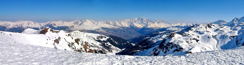panoramic view of the southern slope of the Mont Blanc massif (4810 m), the highest peak in Europe and the Beaufortain valley, from the famous ski resort of La Plagne in the heart of the French Alps