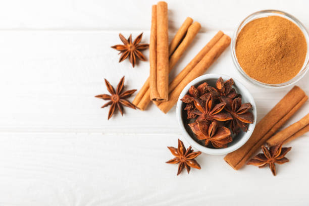 istock Cinnamon sticks and anise on a textured background. Cinnamon roll and star anise. Spicy spice for baking, desserts and drinks. Fragrant ground cinnamon.Place for text. copy space. 2150007568