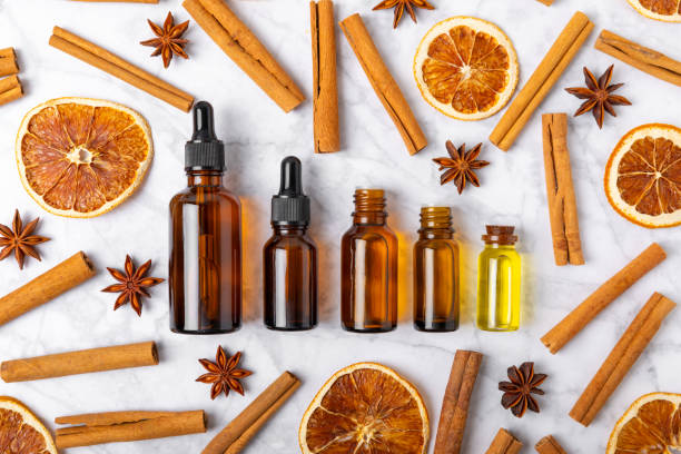 istock Cinnamon aromatic essential oil and cinnamon sticks on a wooden background. Aromatherapy. Organic cosmetic oil. Spa concept. Place for text. Copy space. 2150007652