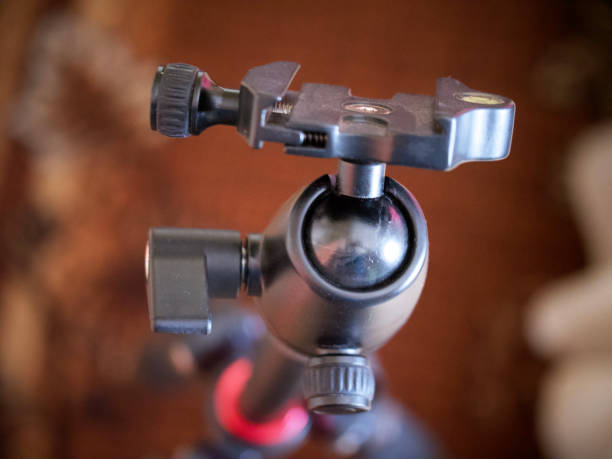 Tripod head for the camera, close-up. A tripod head is the part of a tripod system that attaches the supported device to the tripod legs.