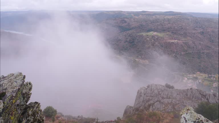 Clouds over mountain and Douro river in Portugal. Timelapse