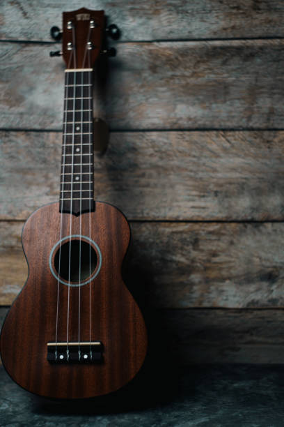 istock Ukulele on gray wood background 2150011044