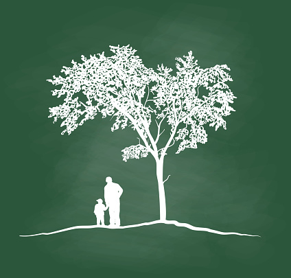 Silhouettes of grandchild and their grandpa outdoors together under a tree