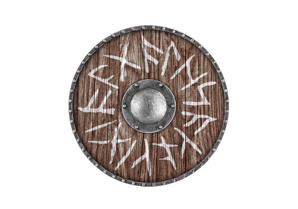istock Old wooden round shield decorated with runes isolated on white background 2150015341