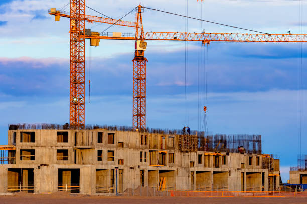 istock Construction site against the blue sky. The frame of the future building and cranes. Construction business. Sale of apartments in buildings under construction. 2150016454