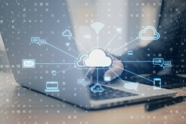 istock Close up of male hand using laptop with creative cloud computing hologram with various icons on blurry background. Cyber data and media concept. 2150017620