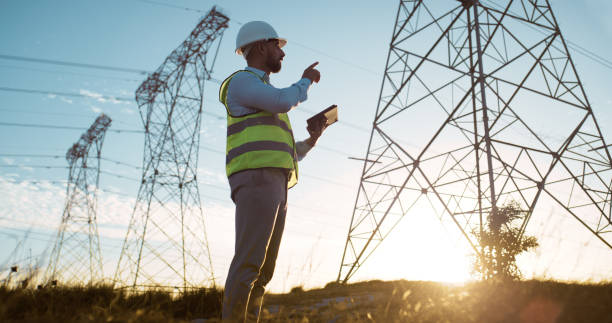 istock Man, sunset or electrical engineer with tablet in power station to test electricity transmission system or safety check. Engineering, inspection or tech app for energy distribution or turbine control 2150018084