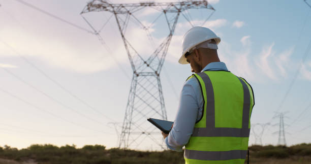istock Man, back and electrical engineer with tablet in power station to test electricity transmission system or safety check. Industry worker, person and tech app for energy distribution or turbine control 2150018096