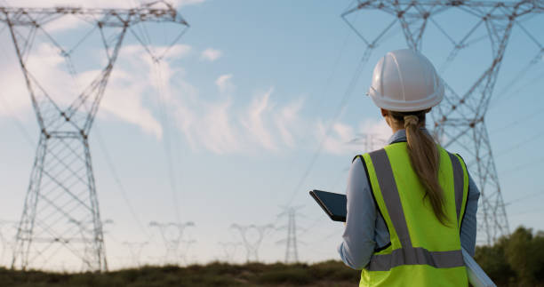 istock Woman, engineering and electrical engineer with tablet in power plant to test electricity transmission system or data transfer. Inspection, back and mockup for energy distribution and tower control 2150018327