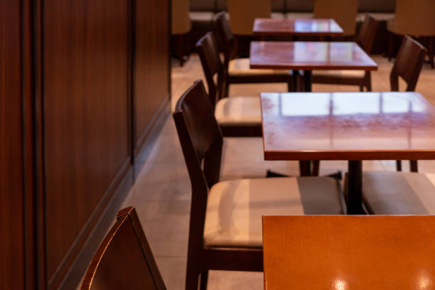 istock rows of wooden chairs and tables 2150019432