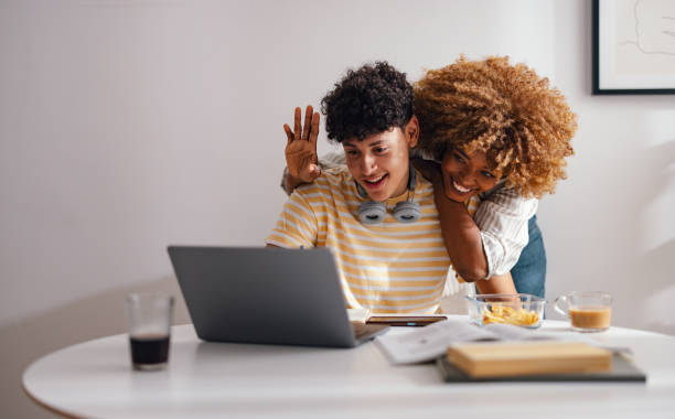istock Joyful Mother and Son Bonding Over Laptop at Home 2150019647