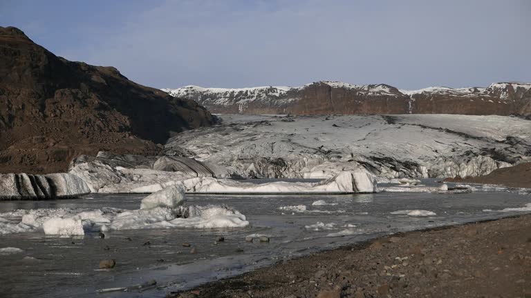 The Solheimajokull Glacier, melt water and small icebergs in early Spring. Southern Iceland. 2024