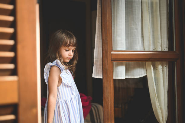 Portrait of a little girl on a white background.