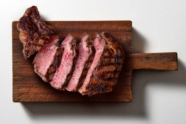 istock Rib eye beef sliced on dark wooden cutting board 2150022399