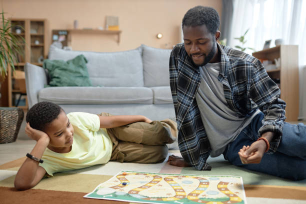 istock African American family playing board game 2150029202