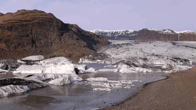 Small Icebergs and mel water at the foot of the Solheimajokull Glacier. Southern Iceland. Early Spring.2024