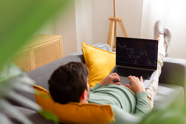 istock Man analyzing stock market from home 2150035788