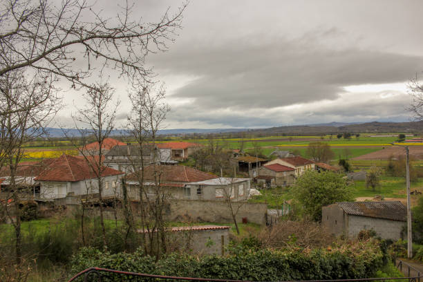 istock village in Galicia, Spain, with yellow fields 2150036654