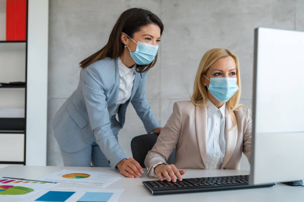 istock Business people working during COVID-19 pandemic 2150041136