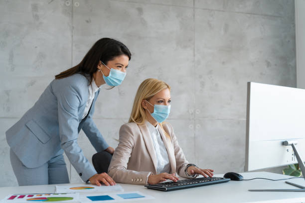 istock Business people working during COVID-19 pandemic 2150041155