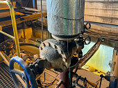 Valves and other safety equipment on an old steam boiler. Extensive wear, corrosion and contamination of the equipment and the boiler