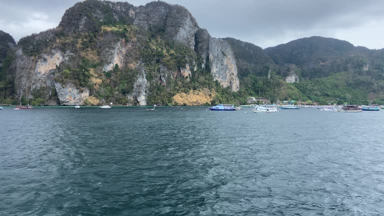 Ferry boats sailing in Phi phi islands in cloudy day