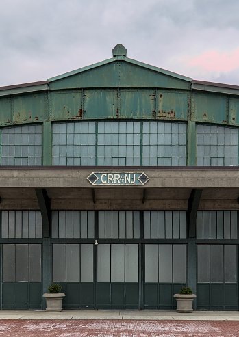 Jersey City, NJ - Apr 6, 2024: Central Railroad of New Jersey (CRR NJ) logo on old disused abandoned train terminal in Liberty State Park, Jersey City, New Jersey.