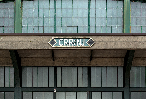 Jersey City, NJ - Apr 6, 2024: Central Railroad of New Jersey (CRR NJ) logo on old disused abandoned train terminal in Liberty State Park, Jersey City, New Jersey.