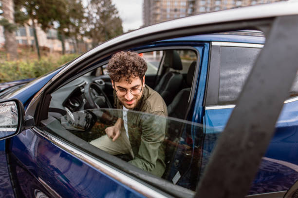 istock Man leaving his car on a parking 2150046112