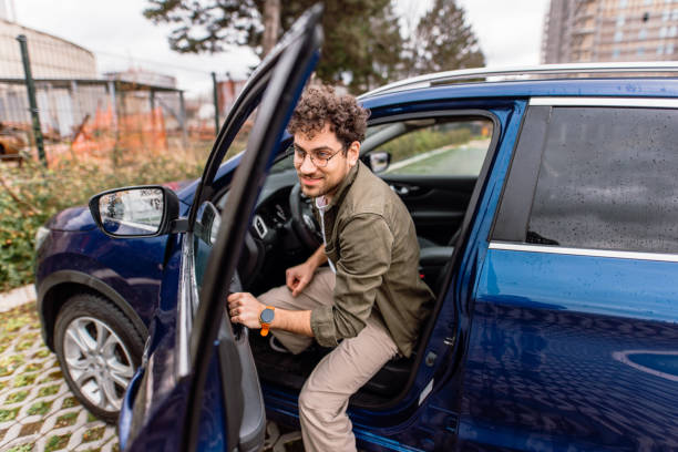 Man leaving his car on a parking