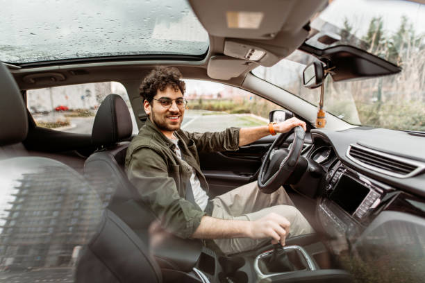 istock Young businessman driving a car 2150046130