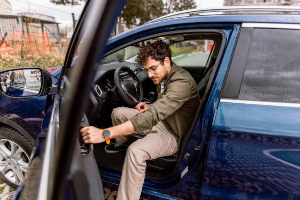 istock Man leaving his car on a parking 2150046140