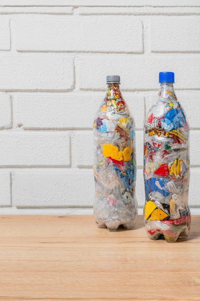 istock 2 two PET bottles filled with plastic waste for eco bricking 2150049773