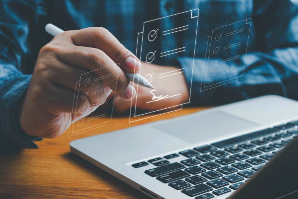 istock Checklist, Digital and smart checklist document concept, Businessman marking on e-checklist on virtual screen and use laptop document management with modern intelligent online systems high security. 2150050092