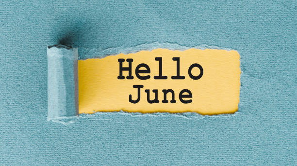 istock Hello June - inscription at light blue torn envelope. First summer day, Calendar concept 2150051181