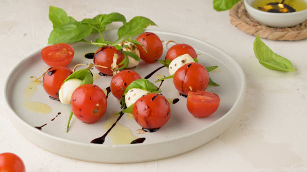 istock Caprese salad with tomato and mozzarella 2150052373