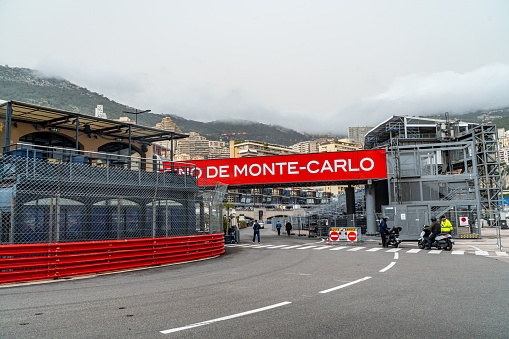 March 29, 2024. La Rascasse corner of the Monaco Formula 1 circuit, open to traffic, with the race fences mounted and the bar of the same name inside.