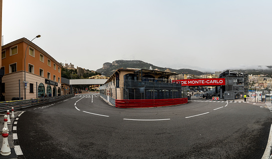 March 29, 2024. Panoramic view of the La Rascasse corner of the Monaco Formula 1 circuit, open to traffic, with the race fences mounted and the bar of the same name inside.