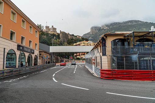 March 29, 2024. La Rascasse corner of the Monaco Formula 1 circuit, open to traffic, with the race fences mounted and the bar of the same name inside.