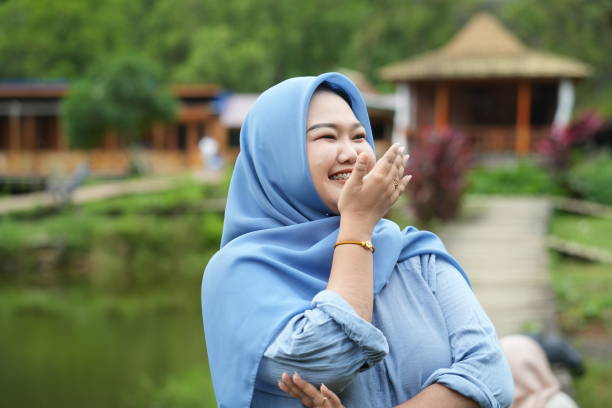 istock Asian model in hijab wearing blue shirt 2150054326