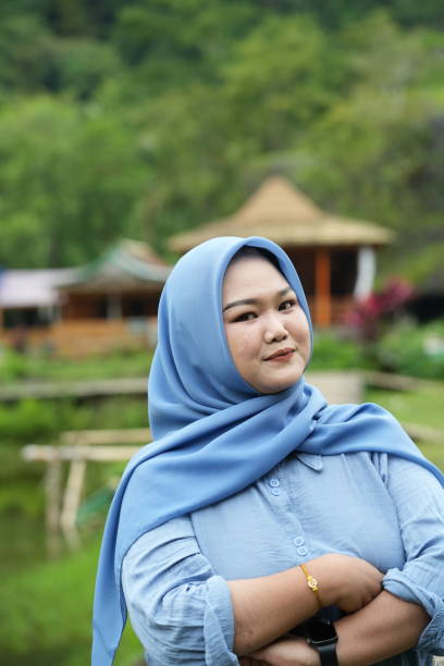istock Asian model in hijab wearing blue shirt 2150054396