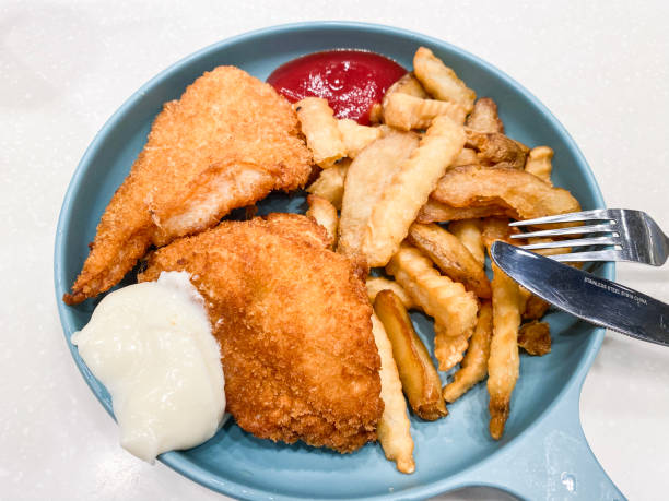 istock Classic Fish and Chips Served on a Blue Plate 2150058705