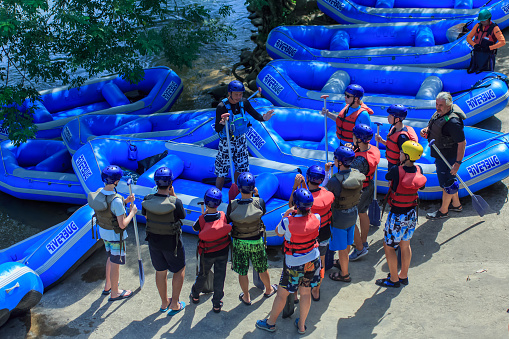 Kiulu Sabah, Malaysia  - Nov 04, 2018: Whitewater rafting guider delivers a river safety briefing and the basics of guiding a raft before starting the whitewater rafting activity at Kiulu river.