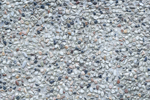The pattern small pebbles stone as background.